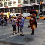 These characters urged tourists to give them a tip (Jen Chung/Gothamist)